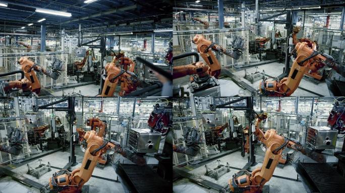 CS男工程师监督工厂工业机器人的工作过程