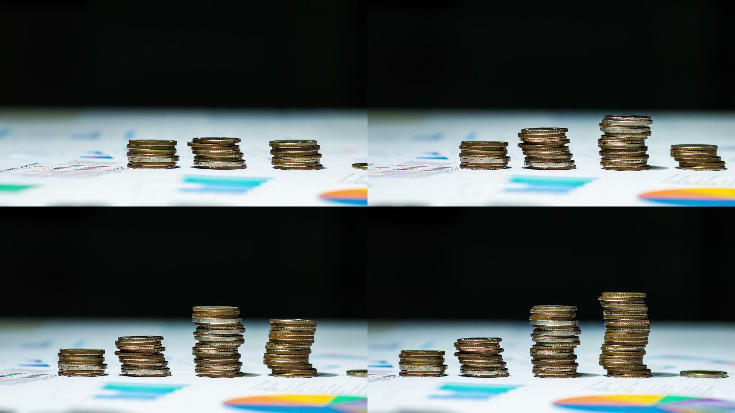 多利拍摄的将硬币堆积在财务文件上的延时视频。