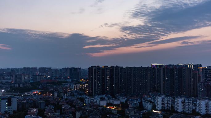 城市日转夜天亮到天黑城市亮灯万家灯火延时