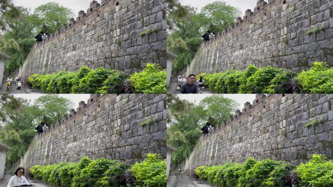 城墙古迹过往的车流电动车