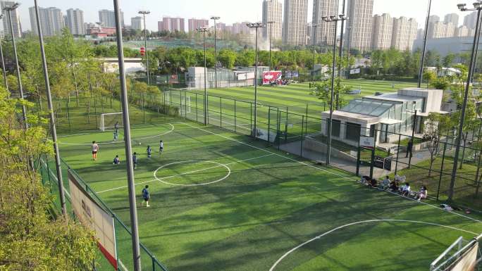 航拍西安曲江文化运动公园踢足球足球场