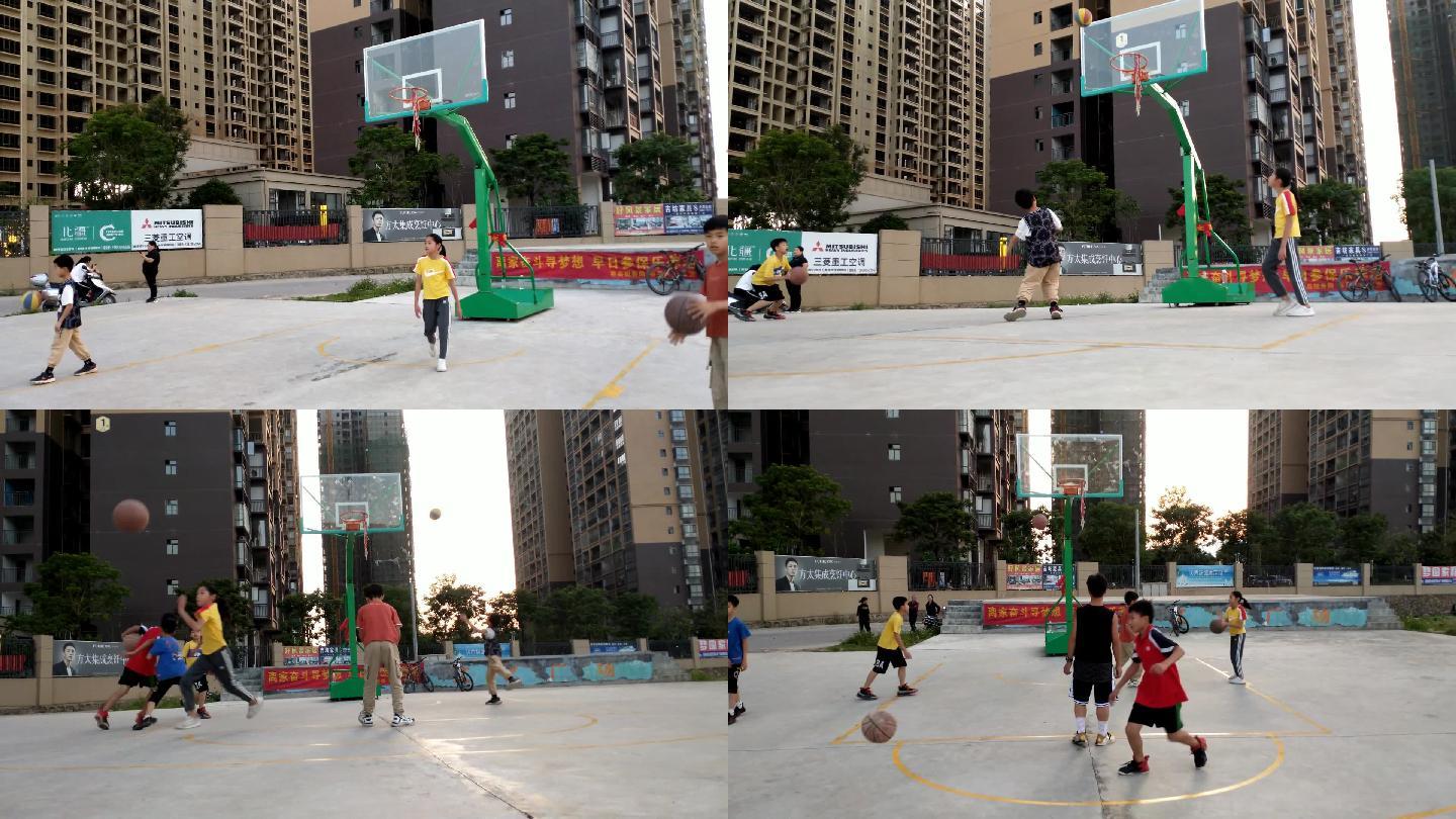 在小区球场打篮球的小孩们打篮球