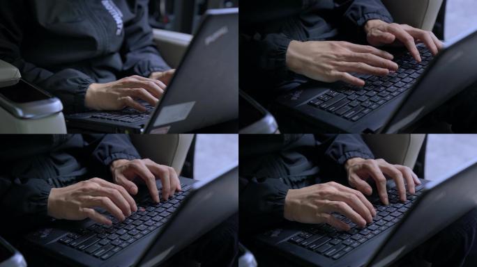 黑衣男子黑客操作电脑带绿屏