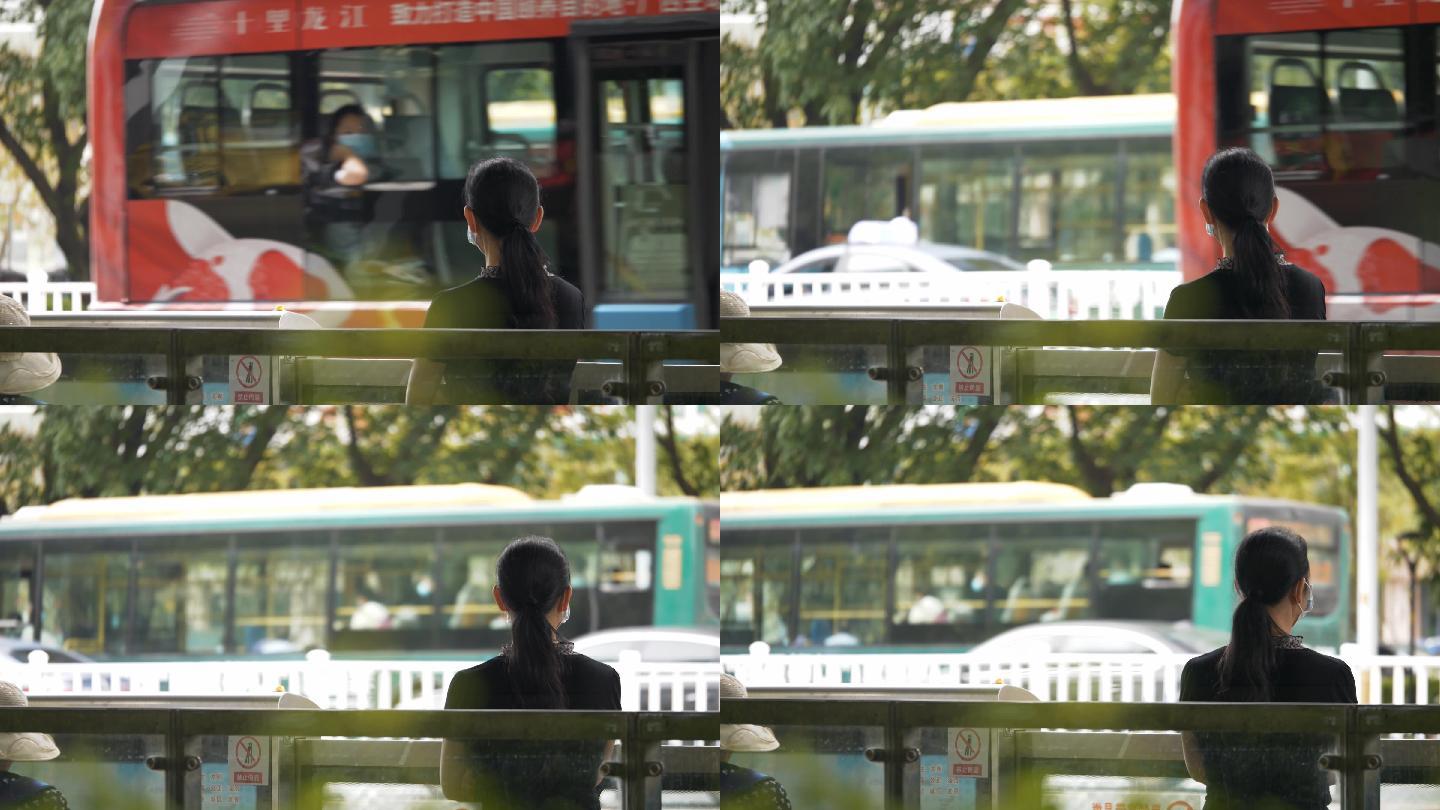 女子在公交车站台等车