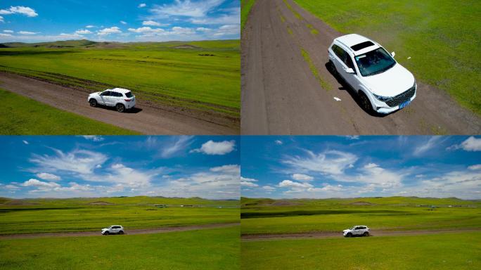4K无人机拍摄汽车在草原上飞驰