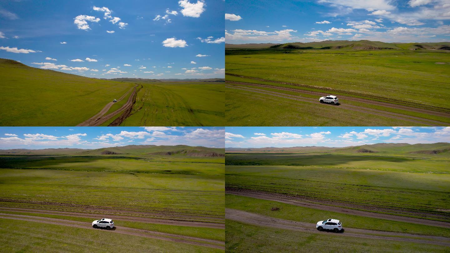 4K无人机拍摄汽车在草原上飞驰