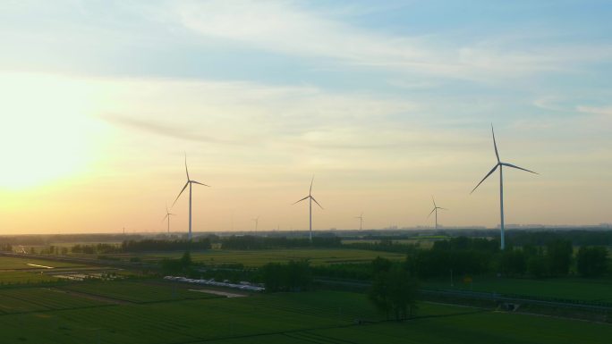 夕阳下麦田风力发电绿色环保唯美风车碳中和