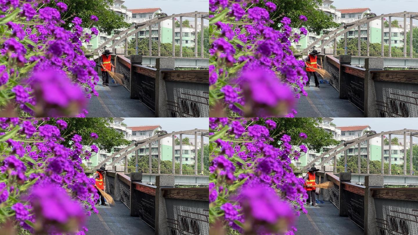 城市绿道花丛后清洁工环卫工人清扫栏杆4K