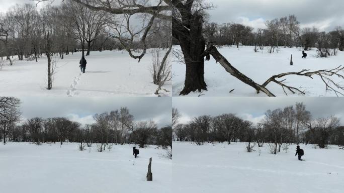 4K60帧人在雪地艰难行走冬天航拍