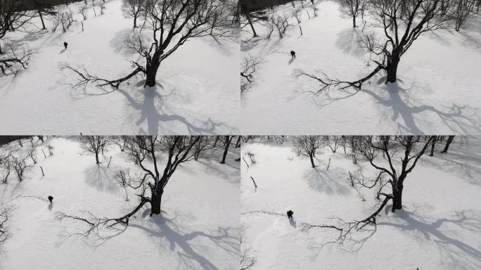 4K60帧人在雪地艰难行走冬天航拍