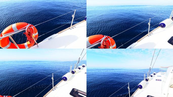 游艇行驶在蓝色的海面