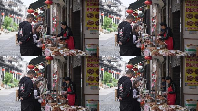 古街商业游客美食摊买小吃