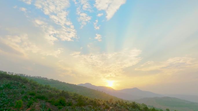 航拍群山古旧建筑夕阳光束