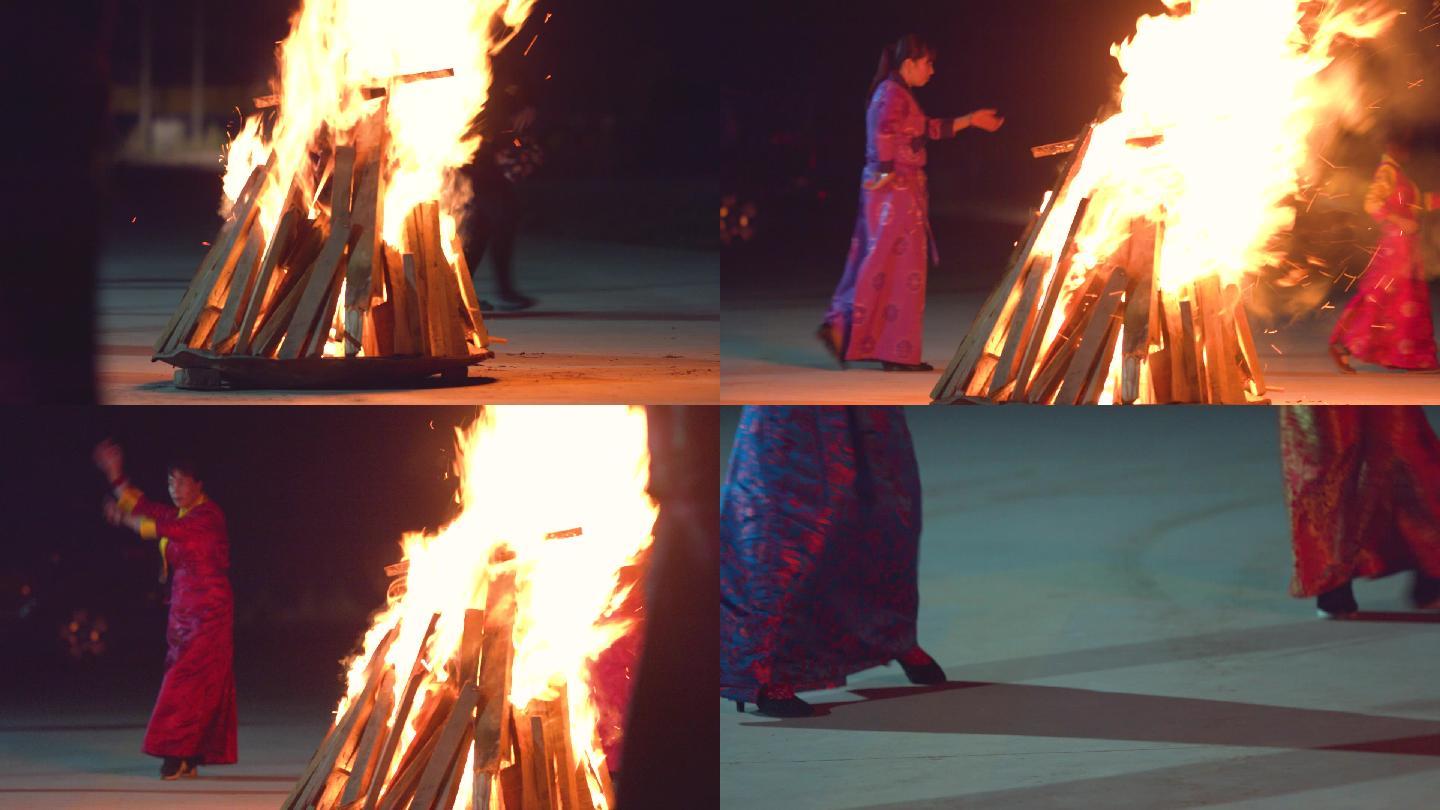 围着篝火跳舞的藏族人
