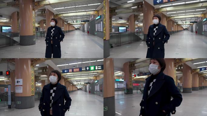 冬天在地铁站内快步行走的东方女性
