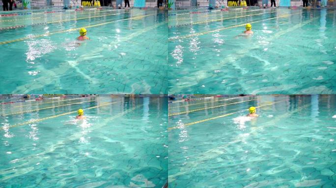 游泳池中练习游泳的中国女孩