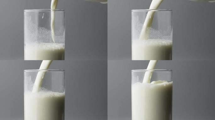慢镜头拍摄倒入玻璃杯的牛奶