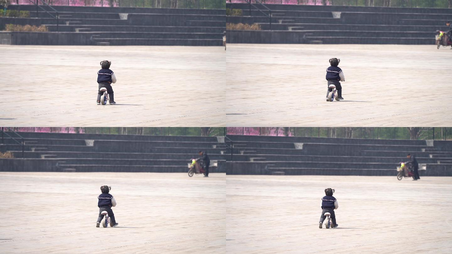 女孩小朋友平衡车公园玩耍学习快乐骑车背影