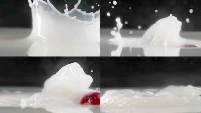 慢镜头拍摄新鲜爆浆草莓落入牛奶创意视频