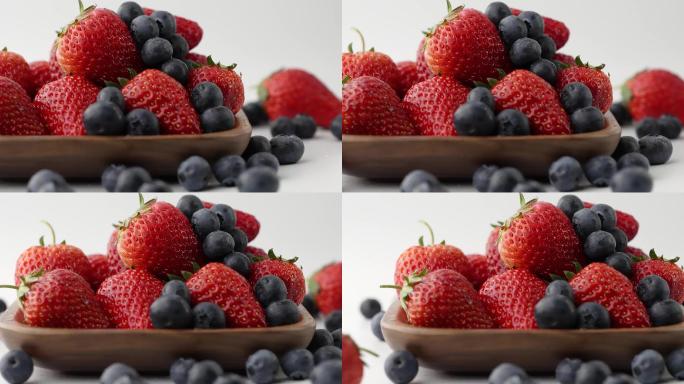 移镜拍摄新鲜草莓落到酸甜可口草莓上