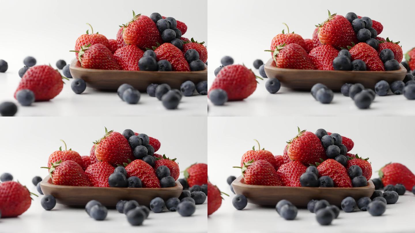 移镜拍摄新鲜草莓落到酸甜可口草莓上