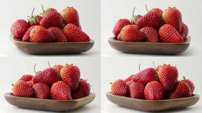 旋转拍摄碗中新鲜爆浆草莓