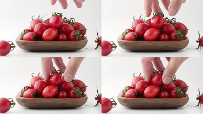 择取碗中新鲜有机小番茄