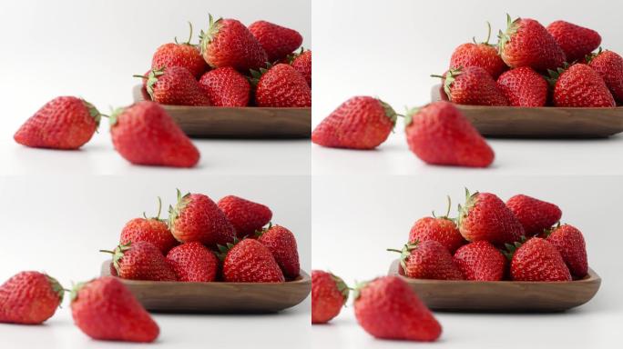 移镜拍摄碗中新鲜爆浆草莓