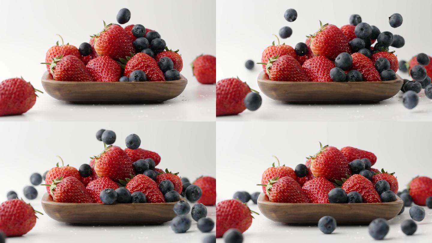 慢镜头拍摄新鲜草莓落到酸甜可口草莓上