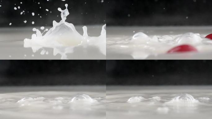 慢镜头拍摄新鲜爆浆小番茄落入牛奶创意视频