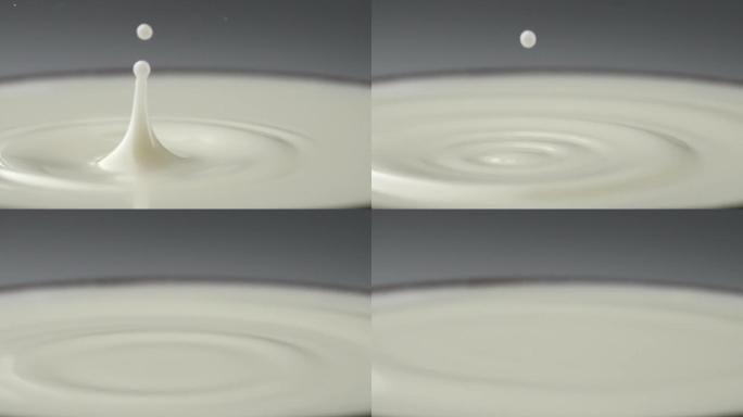 慢镜头拍摄一滴牛奶落到液面创意视频