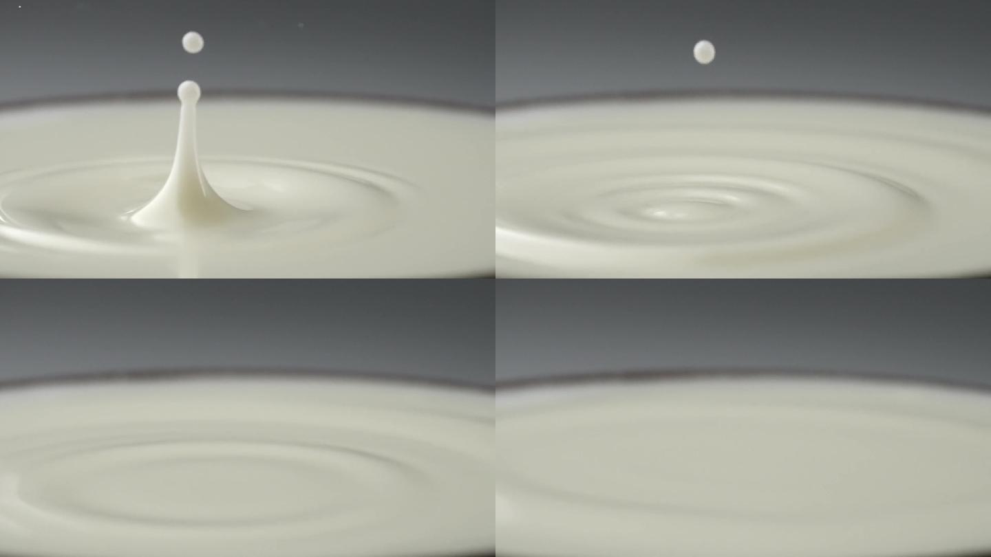 慢镜头拍摄一滴牛奶落到液面创意视频
