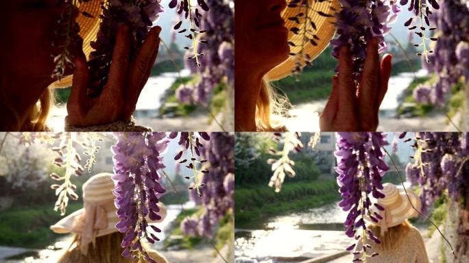 女人走过紫藤花，停下来享受香水