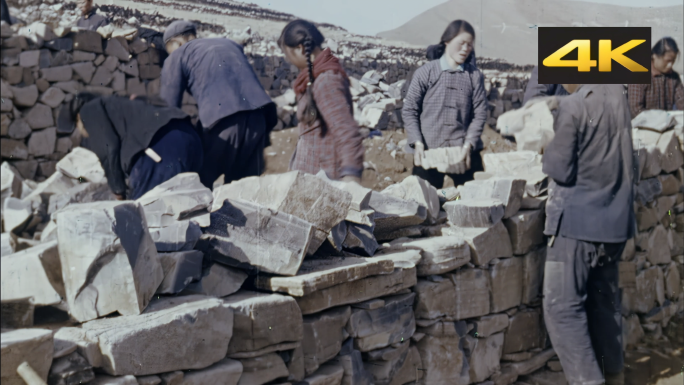 山村农民开采石头砌石垒墙