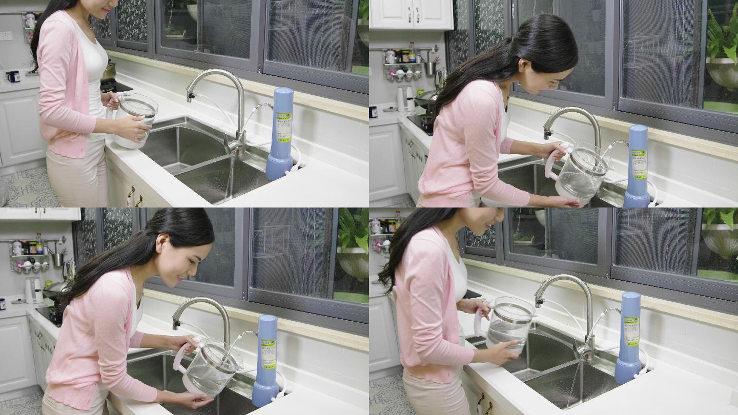 女人接水 净水器 家庭主妇