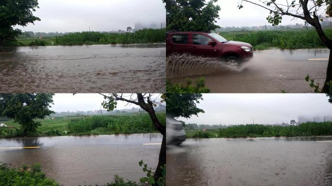 下雨天公路汽车过积水水花飞溅开过积水路段