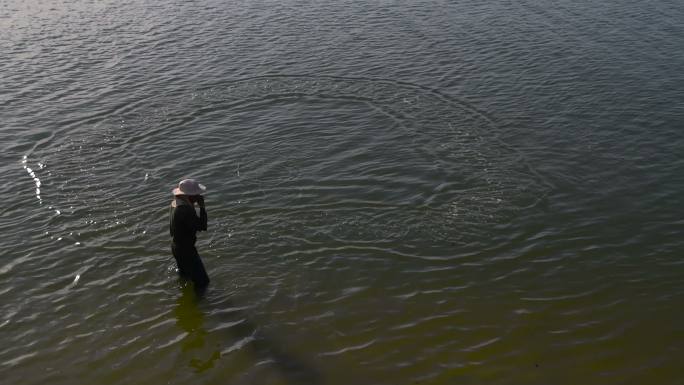 渔夫撒网，日出场景，泰国