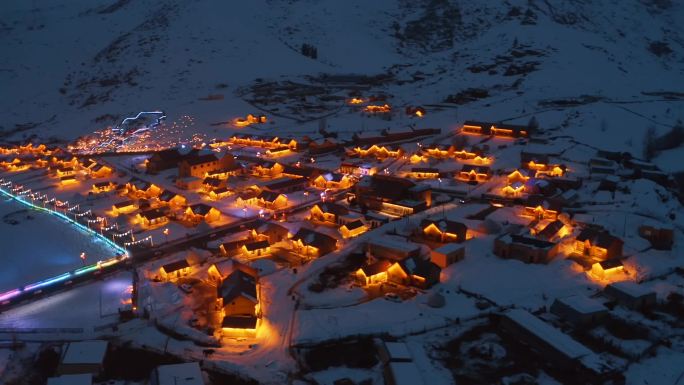 雪后新疆可可托海三号坑额河第一村航拍夜景