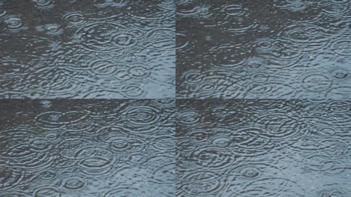 4K正版-下雨天雨滴落在路面积水倒影