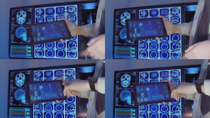 特写手专业外科医生在数字平板电脑上观看脑部扫描