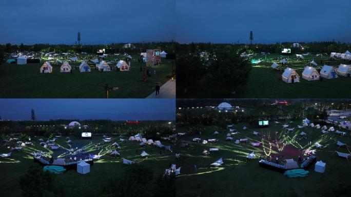 户外帐篷露营夜景在帐篷营地看电影户外露营