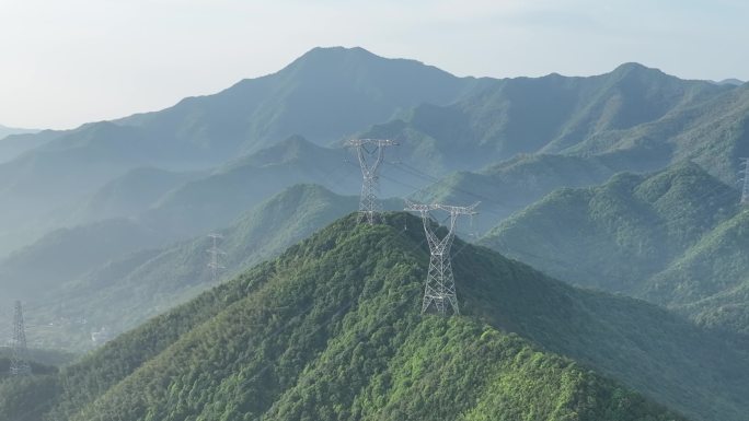 航拍这件山区高山山顶电线电塔高压线电网