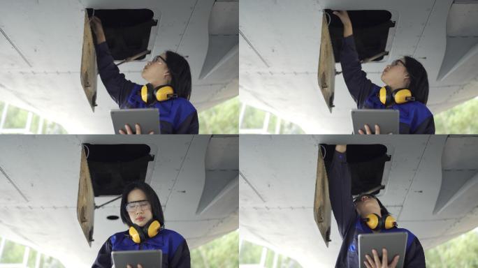 4K女飞机工程师使用数字平板电脑检查飞机起落架