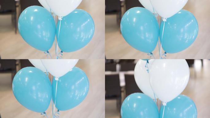 一堆用丝带绑着的充氦气球