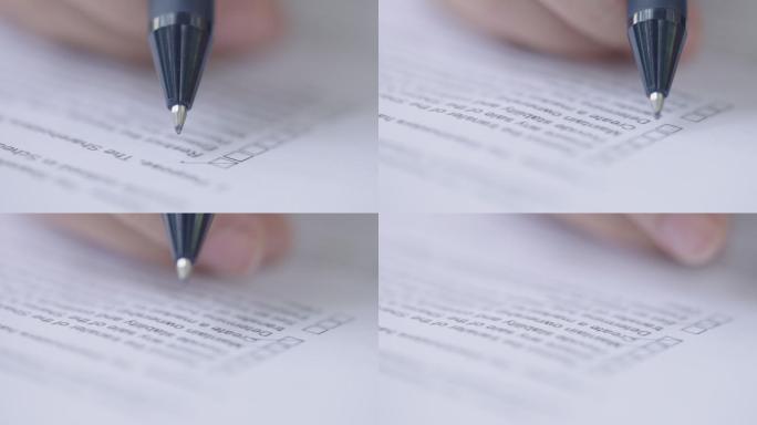 在协议纸上的方框列表中使用钢笔勾选复选标记的无法识别的手