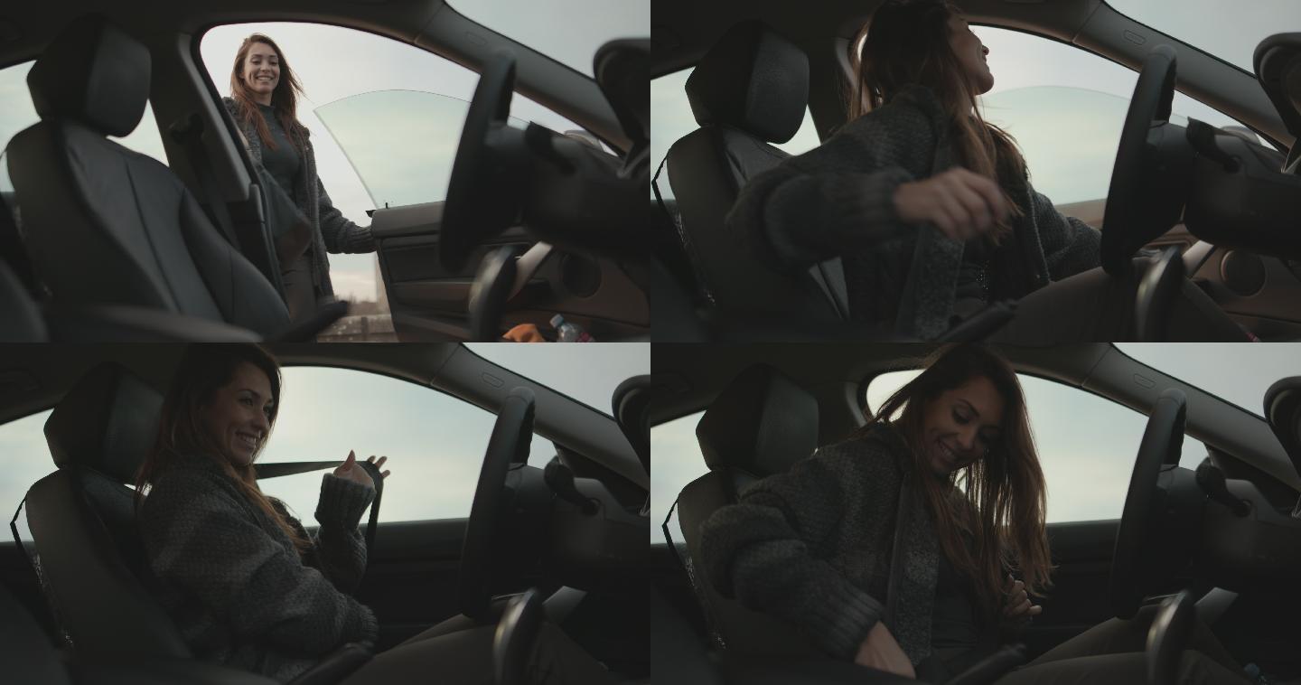 微笑的年轻女子坐在车里，系上安全带