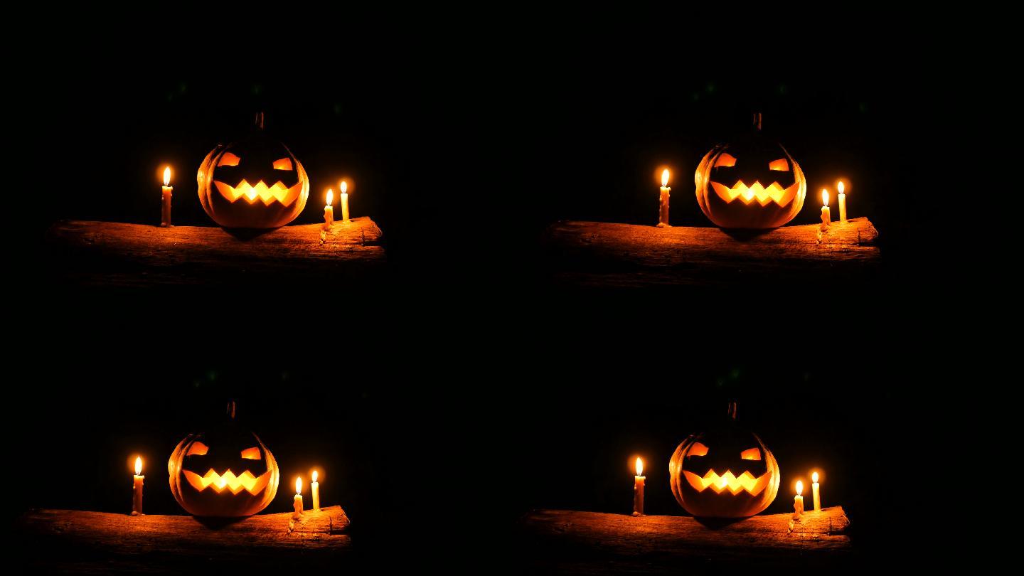 万圣节杰克O灯，黑暗中树干上插着蜡烛，多莉拍摄