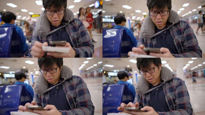 男人在读了智能手机上的信息后情绪低落，比如航班延误，坏消息