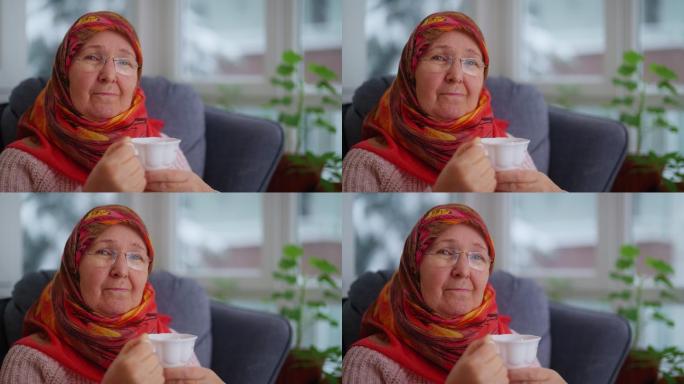 穆斯林妇女在家放松的肖像