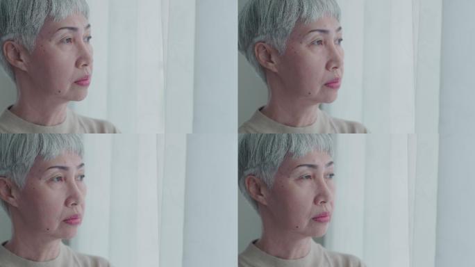 亚洲女人望着窗外老太太老人抑郁症